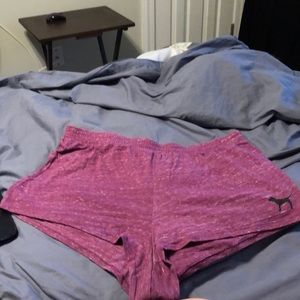 Purple shorts from Victoria’s Secret Pink with black dog logo on front